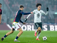 Maghnes Akliouche of AS Monaco and Stefan Posch of Bologna FC compete for the ball during the UEFA Champions League 2024/25 League Phase MD4...