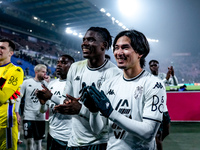 Breel Embolo of AS Monaco and Takumi Minamino celebrate the victory during the UEFA Champions League 2024/25 League Phase MD4 match between...