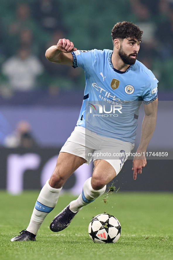 Josko Gvardiol of Manchester City is in action during the UEFA Champions League match between Sporting CP and Manchester City at Jose Alvala...