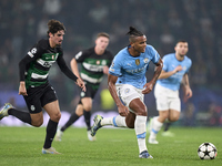 Manuel Akanji of Manchester City is challenged by Francisco Trincao of Sporting CP during the UEFA Champions League match between Sporting C...