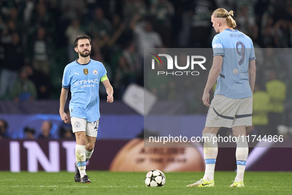 Erling Haaland (right) and Bernardo Silva (left) of Manchester City react after Maxi Araujo of Sporting CP (not in frame) scores his team's...