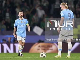 Erling Haaland (right) and Bernardo Silva (left) of Manchester City react after Maxi Araujo of Sporting CP (not in frame) scores his team's...