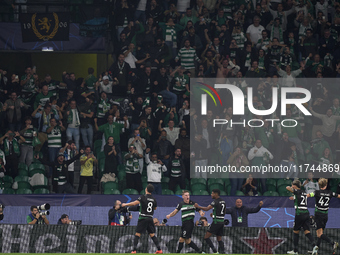 Viktor Gyokeres of Sporting CP celebrates with his teammates after scoring his team's third goal during the UEFA Champions League match betw...