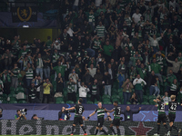 Viktor Gyokeres of Sporting CP celebrates with his teammates after scoring his team's third goal during the UEFA Champions League match betw...