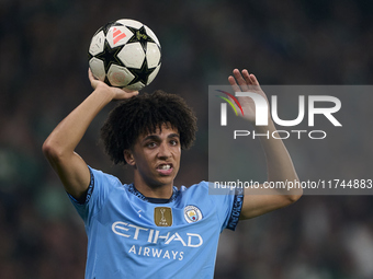 Rico Lewis of Manchester City takes a throw-in during the UEFA Champions League match between Sporting CP and Manchester City at Jose Alvala...