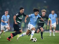 Pedro Goncalves of Sporting CP competes for the ball with Rico Lewis of Manchester City during the UEFA Champions League match between Sport...