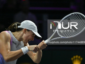 RIYADH, SAUDI ARABIA - NOVEMBER 05: Iga Swiatek of Poland during her match against Coco Gauff of USA, on day 4 of the 2024 WTA Finals, part...