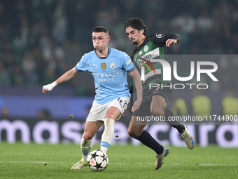 Francisco Trincao of Sporting CP competes for the ball with Phil Foden of Manchester City during the UEFA Champions League match between Spo...