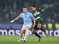 Francisco Trincao of Sporting CP competes for the ball with Phil Foden of Manchester City during the UEFA Champions League match between Spo...