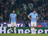 Mateo Kovacic (right) and Manuel Akanji (left) of Manchester City react after Viktor Gyokeres of Sporting CP scores his team's fourth goal d...