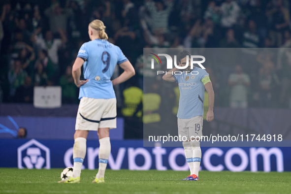 Ilkay Gundogan (right) and Erling Haaland (left) of Manchester City react after Viktor Gyokeres of Sporting CP scores his team's fourth goal...