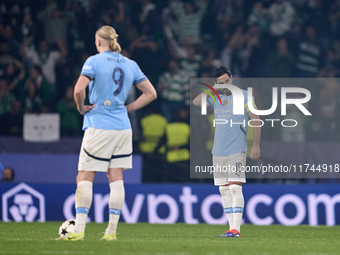 Ilkay Gundogan (right) and Erling Haaland (left) of Manchester City react after Viktor Gyokeres of Sporting CP scores his team's fourth goal...