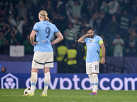 Ilkay Gundogan (right) and Erling Haaland (left) of Manchester City react after Viktor Gyokeres of Sporting CP scores his team's fourth goal...