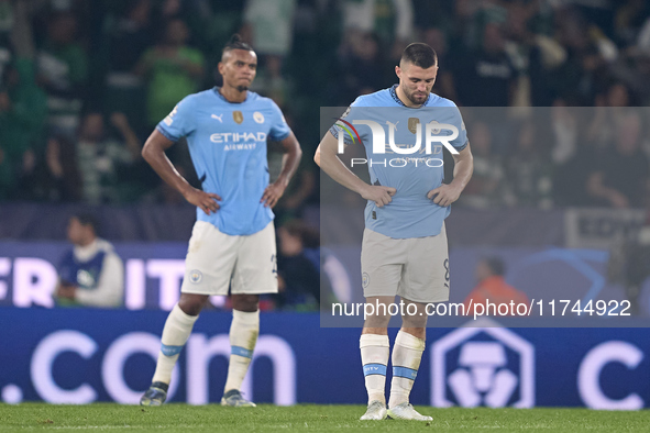 Mateo Kovacic (right) and Manuel Akanji (left) of Manchester City react after Viktor Gyokeres of Sporting CP scores his team's fourth goal d...