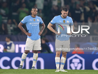 Mateo Kovacic (right) and Manuel Akanji (left) of Manchester City react after Viktor Gyokeres of Sporting CP scores his team's fourth goal d...