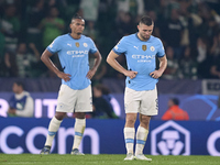 Mateo Kovacic (right) and Manuel Akanji (left) of Manchester City react after Viktor Gyokeres of Sporting CP scores his team's fourth goal d...