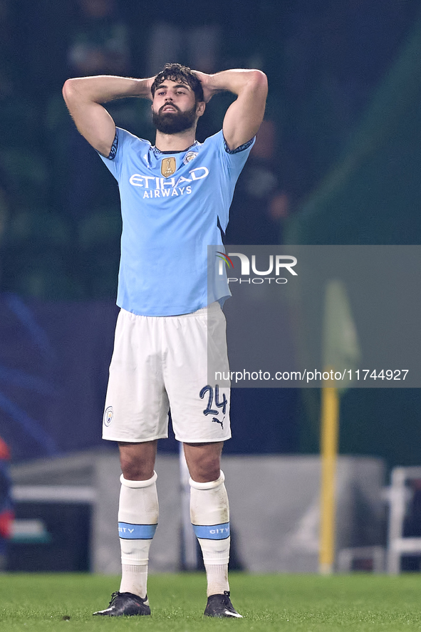 Josko Gvardiol of Manchester City reacts after Viktor Gyokeres of Sporting CP scores his team's fourth goal during the UEFA Champions League...