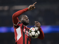 Youssouf Fofana of AC Milan celebrates victory during the UEFA Champions League 2024/25 match between Real Madrid and AC Milan at Santiago B...