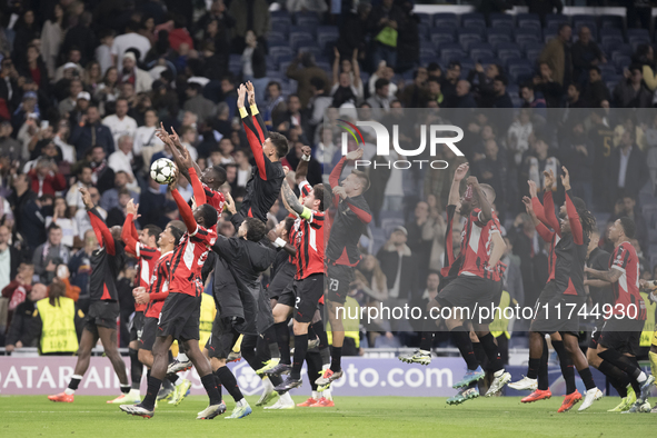 AC Milan players celebrate victory during the UEFA Champions League 2024/25 match between Real Madrid and AC Milan at Santiago Bernabeu Stad...