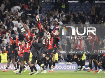 AC Milan players celebrate victory during the UEFA Champions League 2024/25 match between Real Madrid and AC Milan at Santiago Bernabeu Stad...