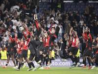 AC Milan players celebrate victory during the UEFA Champions League 2024/25 match between Real Madrid and AC Milan at Santiago Bernabeu Stad...