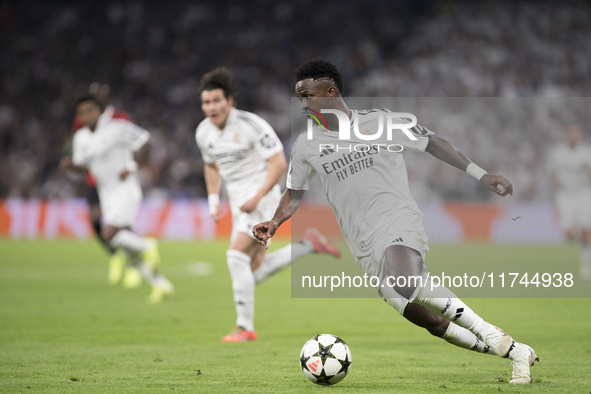 Vinicius Jr of Real Madrid is in action during the UEFA Champions League 2024/25 match between Real Madrid and AC Milan at Santiago Bernabeu...