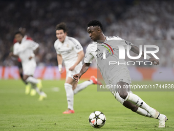 Vinicius Jr of Real Madrid is in action during the UEFA Champions League 2024/25 match between Real Madrid and AC Milan at Santiago Bernabeu...