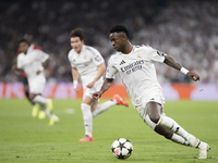 Vinicius Jr of Real Madrid is in action during the UEFA Champions League 2024/25 match between Real Madrid and AC Milan at Santiago Bernabeu...