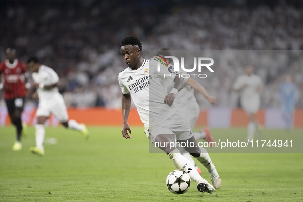 Vinicius Jr of Real Madrid is in action during the UEFA Champions League 2024/25 match between Real Madrid and AC Milan at Santiago Bernabeu...