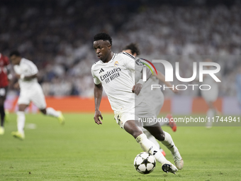 Vinicius Jr of Real Madrid is in action during the UEFA Champions League 2024/25 match between Real Madrid and AC Milan at Santiago Bernabeu...