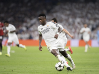 Vinicius Jr of Real Madrid is in action during the UEFA Champions League 2024/25 match between Real Madrid and AC Milan at Santiago Bernabeu...