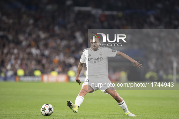 Dani Ceballos of Real Madrid is in action during the UEFA Champions League 2024/25 match between Real Madrid and AC Milan at Santiago Bernab...