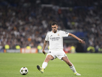 Dani Ceballos of Real Madrid is in action during the UEFA Champions League 2024/25 match between Real Madrid and AC Milan at Santiago Bernab...