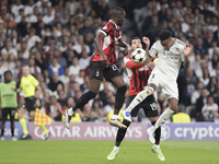 Eder Militao of Real Madrid attempts a header during the UEFA Champions League 2024/25 match between Real Madrid and AC Milan at Santiago Be...