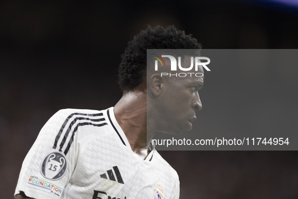 Vinicius Jr of Real Madrid plays during the UEFA Champions League 2024/25 match between Real Madrid and AC Milan at Santiago Bernabeu Stadiu...