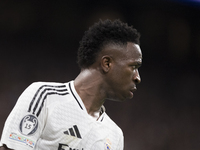 Vinicius Jr of Real Madrid plays during the UEFA Champions League 2024/25 match between Real Madrid and AC Milan at Santiago Bernabeu Stadiu...