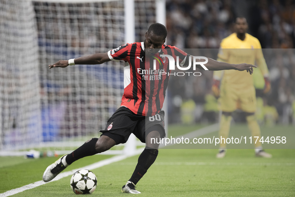 Yunus Musah of AC Milan is in action during the UEFA Champions League 2024/25 match between Real Madrid and AC Milan at Santiago Bernabeu St...