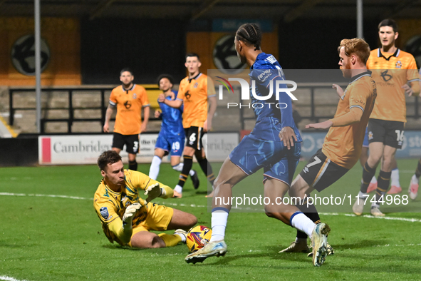 Goalkeeper Jack Stevens (1, Cambridge United) saves from Ishe Samuels Smith (62, Chelsea) during the EFL Trophy match between Cambridge Unit...