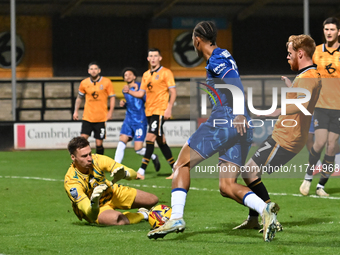 Goalkeeper Jack Stevens (1, Cambridge United) saves from Ishe Samuels Smith (62, Chelsea) during the EFL Trophy match between Cambridge Unit...