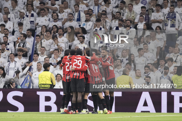 Several players of AC Milan celebrate a goal during the UEFA Champions League 2024/25 match between Real Madrid and AC Milan at Santiago Ber...