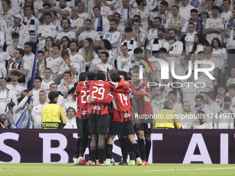 Several players of AC Milan celebrate a goal during the UEFA Champions League 2024/25 match between Real Madrid and AC Milan at Santiago Ber...