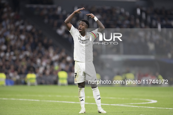 Vinicius Jr of Real Madrid reacts to a missed opportunity during the UEFA Champions League 2024/25 match between Real Madrid and AC Milan at...