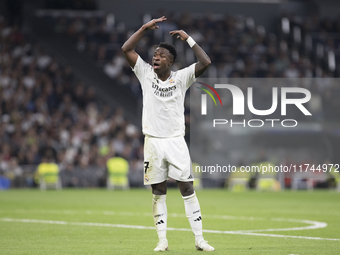 Vinicius Jr of Real Madrid reacts to a missed opportunity during the UEFA Champions League 2024/25 match between Real Madrid and AC Milan at...