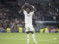 Vinicius Jr of Real Madrid reacts to a missed opportunity during the UEFA Champions League 2024/25 match between Real Madrid and AC Milan at...