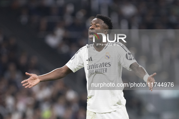 Vinicius Jr of Real Madrid reacts to a missed opportunity during the UEFA Champions League 2024/25 match between Real Madrid and AC Milan at...