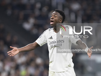 Vinicius Jr of Real Madrid reacts to a missed opportunity during the UEFA Champions League 2024/25 match between Real Madrid and AC Milan at...