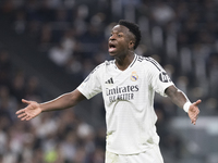 Vinicius Jr of Real Madrid reacts to a missed opportunity during the UEFA Champions League 2024/25 match between Real Madrid and AC Milan at...