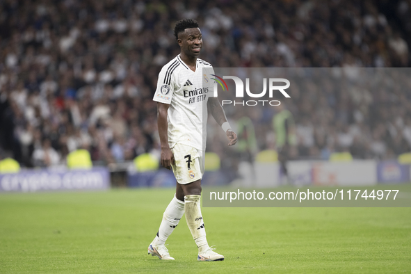 Vinicius Jr of Real Madrid reacts to a missed opportunity during the UEFA Champions League 2024/25 match between Real Madrid and AC Milan at...