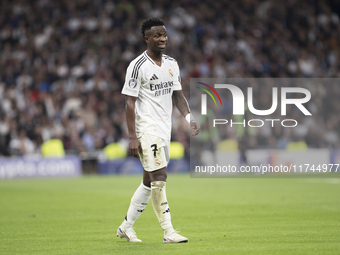 Vinicius Jr of Real Madrid reacts to a missed opportunity during the UEFA Champions League 2024/25 match between Real Madrid and AC Milan at...