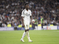 Vinicius Jr of Real Madrid reacts to a missed opportunity during the UEFA Champions League 2024/25 match between Real Madrid and AC Milan at...